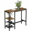 VASAGLE Table Haute, Table à Manger, Table De Bar, Avec Supports Pour Verres Et Bouteilles, Pour Salon, Cuisine, 110 X 40 X 90 Cm, Style Industriel, Marron Rustique Et Noir Par SONGMICS LBT013B01 - Marron Rustique Et Noir -SONGMICS Soldes 39509787 1